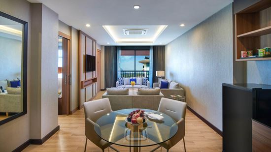 Separate living and dining room in One Bedroom Suite River View with Balcony