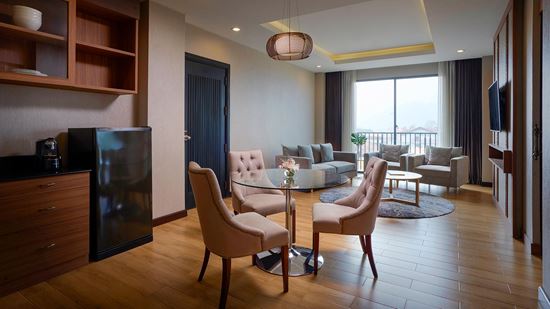 Separate living and dining room in One Bedroom Suite River View with Balcony